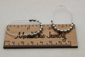 Floral sterling silver hoop earring