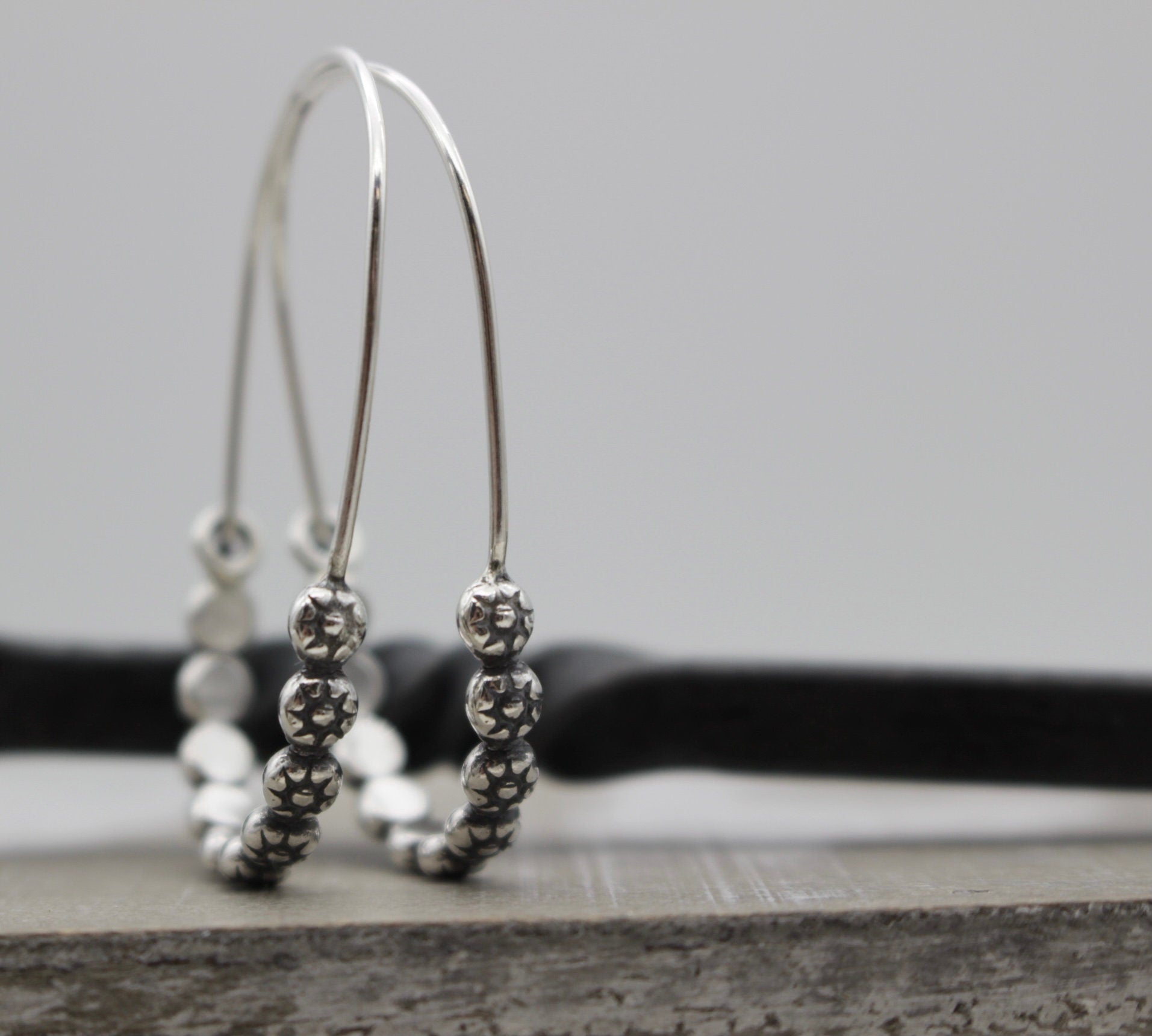 Floral sterling silver hoop earring