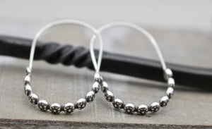 Floral sterling silver hoop earring